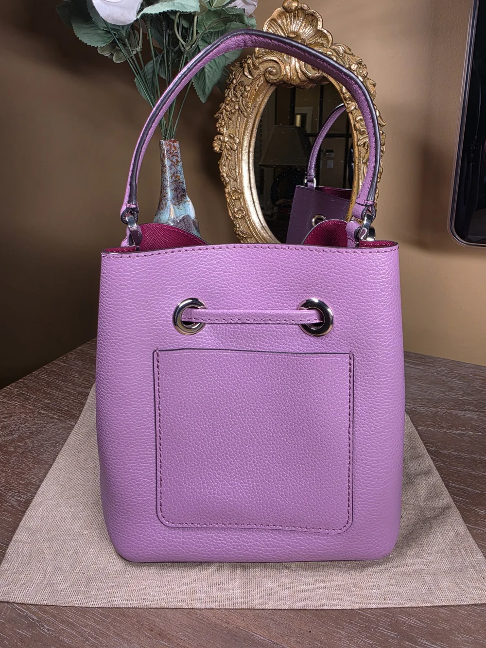 kate spade New York Eva Lavender Mauve Pebbled Leather Bucket Crossbody ($329)